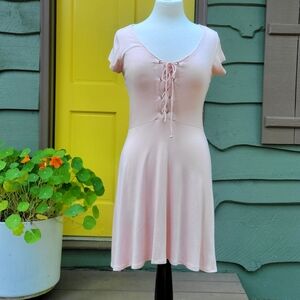 NWT. Soft and flattering lace-up mini dress from Alya, sold at Francesca’s.